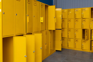 bright yellow open locker rooms with numbering