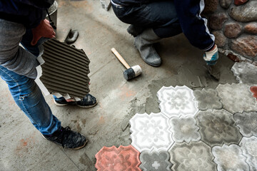 Laying paving slabs and borders at construction site.