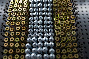 golden and silver strong nails close-up in a hardware store