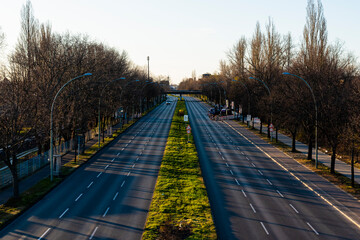 Adlergerstell in Berlin, Germany, city inwards, at sunset, a four-lane street in Berlin