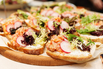 Bruschettas with chopped salmon fillet, toned