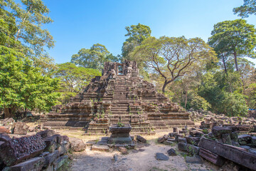 Ancient Preah Palilay temple in Angkor Thom and huge Banyan trees. Angkor, Cambodia.