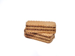 Vanilla wafers isolated on white background. Wafers filled with chocolate and vanilla cream. Crunchy dessert.