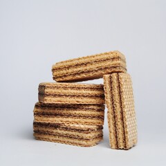 Vanilla wafers isolated on white background. Wafers filled with chocolate and vanilla cream. Crunchy dessert.
