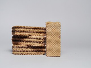 Vanilla wafers isolated on white background. Wafers filled with chocolate and vanilla cream. Crunchy dessert.