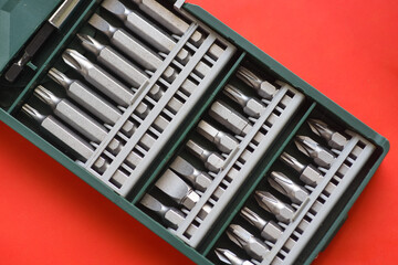 Close up photo of Drill bit set on red background