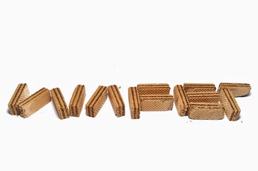 Vanilla wafers isolated on white background. Wafers filled with chocolate and vanilla cream. Crunchy dessert.