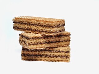 Vanilla wafers isolated on white background. Wafers filled with chocolate and vanilla cream. Crunchy dessert.