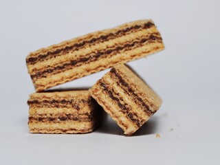 Vanilla wafers isolated on white background. Wafers filled with chocolate and vanilla cream. Crunchy dessert.