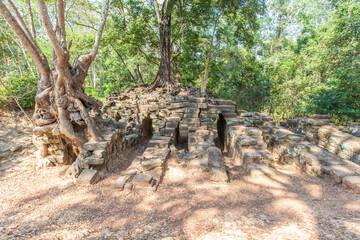 Ancient Preah Palilay temple in Angkor Thom and huge Banyan trees. Angkor, Cambodia.