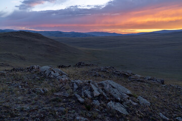 Fiery sunset in the rocky Baikal steppe