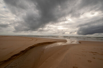 dark clouds over the sandy beach
