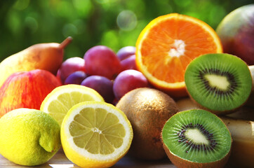 Fototapeta na wymiar sliced citric fruits, kiwi and grapes
