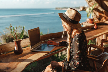 Business woman working with computer on the beach.  Freelance concept. Pretty young woman using...