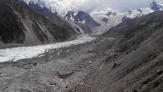 Aerial view of the Nanga Parbat Rakhiot morraine glacier, scattered with rocks and ice, snowy mountaineous landscape, near the Karakorum highway, Gilgit Baltistan region, Pakistan 