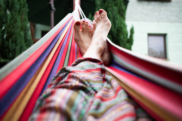 woman feet relaxing in hammock summer zen