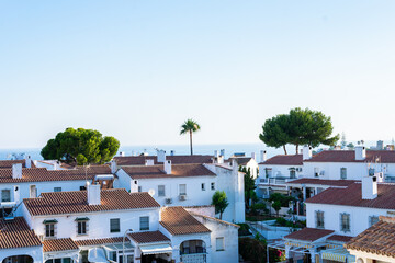Coast city and blue landscape with white houses in Malaga