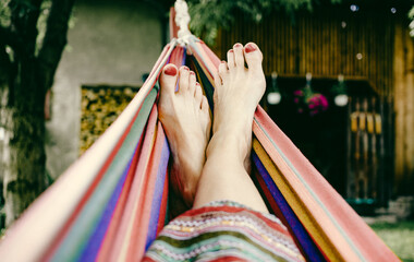 woman feet relaxing in hammock summer zen