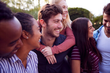 Group Of Multi-Cultural Friends Enjoying Outdoor Summer Garden Party