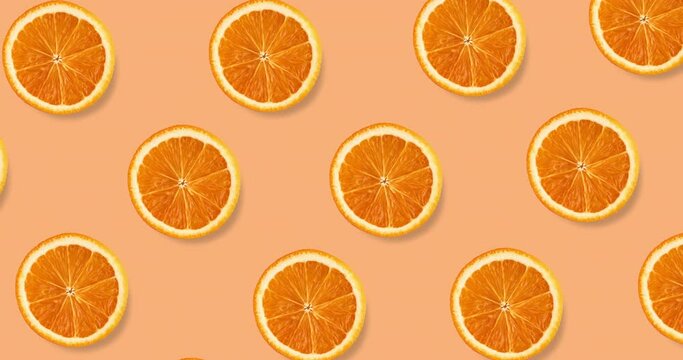Seamless pattern with many real orange slices animated on a pastel background, flat lay composition
