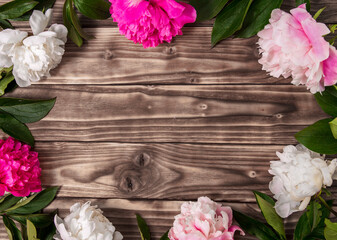 Pink beautiful flowers on shabby wooden background. Universal greeting card