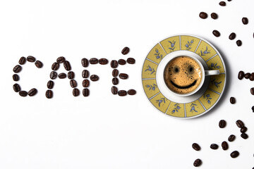 Coffee in the cup with coffee beans around