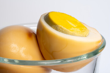 Close-up of baked eggs in a clear cup