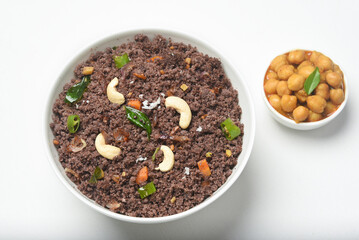 Popular South Indian breakfast Ragi Puttu, Pittu, Kezhvaragu chickpea curry, banana popular  home made Kerala breakfast from finger millet flour Karnataka, India. South Indian food steamed cooked