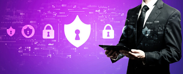 Fototapeta premium Cyber security theme with businessman using his tablet computer