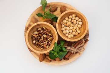 various nuts on a wooden plate
