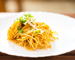 Spaghetti aglio olio on white isolated background