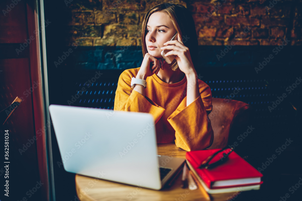 Aufkleber thoughtful businesswoman solving work's problem during mobile conversation looking out of window wor