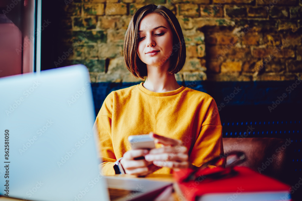 Aufkleber pensive young woman reading incoming notification on smartphone using 4g internet connection during 