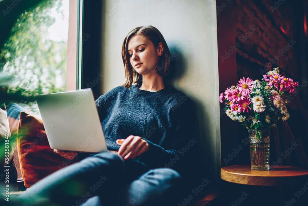 Aufkleber casual dressed young woman updating software for installing application on laptop computer via high 