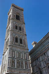 Fototapeta na wymiar View on the tower of the dome of Santa Maria del Fiore church in Florence, Italy with blue sky