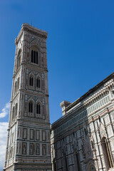 View on the tower of the dome of Santa Maria del Fiore church in Florence, Italy with blue sky
