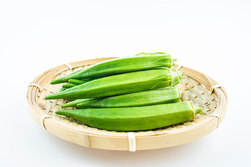 Fresh vegetable okra on white background