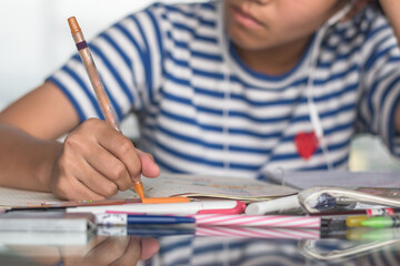 Study at home for education, back to school and literacy day concept with girl kid student self-learning doing homework writing, taking note on desk