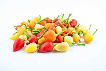 Bunch of fresh colorful peppers on white background