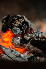 Decaying coals for cooking and a background