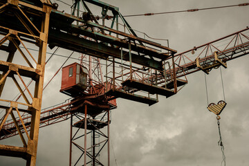 Old construction cranes at the construction of sky