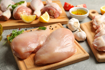 Composition with raw chicken meat on gray background, close up. Cooking chicken