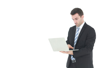 Successful and handsome  businessman in a suit smiling with hand holding notebook. He serious in working on a laptop isolated on white background. Copy space