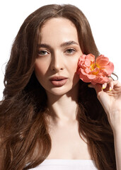 holding a rose flower in his hand. Young beautiful girl with fresh makeup and long hair. Spring look.