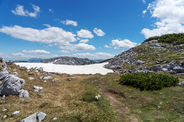 The last snow on the Krippenstein mountain in the Dachstein Mountains. Salzkammergut. Austria