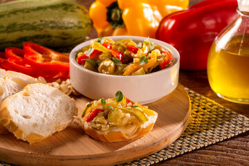 Cooking of zucchini salad with vegetables , tomatoes, pepper, olive and vegetable oil.