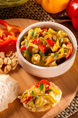 Cooking of zucchini salad with vegetables , tomatoes, pepper, olive and vegetable oil.