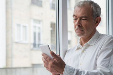 mature man using mobile phone