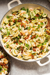 Tagliatelle pasta with broccoli, courgette, shrimps, white wine and sun dried tomatoes breadcrumbs
