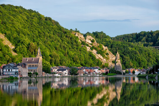 View of picturesque Dinant city over the Meuse river Dinant is a Walloon city and municipality located on the River Meuse, in the Belgian province of Namur on sunset with Bayard Rock and highway